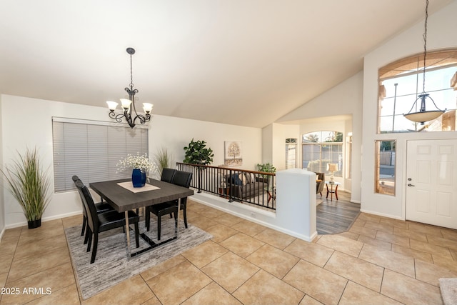 dining room featuring high vaulted ceiling, light tile patterned floors, and a chandelier