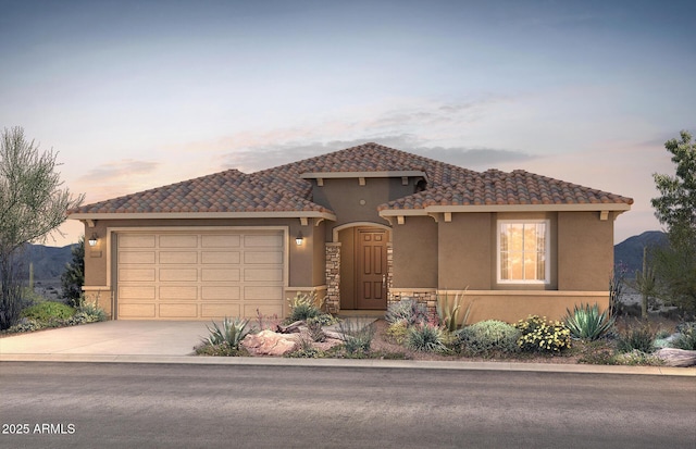 view of front of property featuring a garage, concrete driveway, a tiled roof, and stucco siding