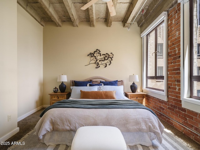 114 W Adams St Unit 907, Phoenix, AZ 85003 - carpeted bedroom with beam ceiling and baseboards