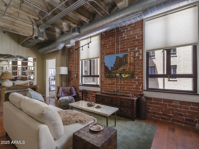 114 W Adams St Unit 907, Phoenix, AZ 85003 - living room with brick wall and hardwood / wood-style flooring