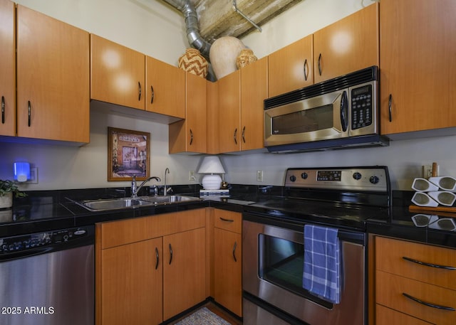 114 W Adams St Unit 907, Phoenix, AZ 85003 - kitchen featuring appliances with stainless steel finishes, a sink, and dark countertops