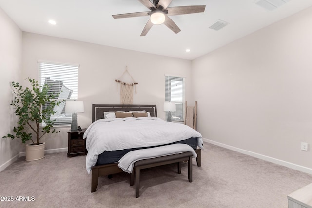 bedroom with light colored carpet, baseboards, and visible vents