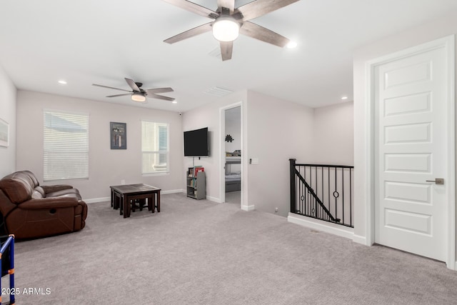 living area with visible vents, baseboards, a ceiling fan, carpet floors, and recessed lighting