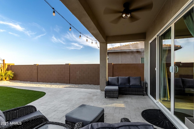 view of patio featuring a fenced backyard, ceiling fan, and an outdoor hangout area