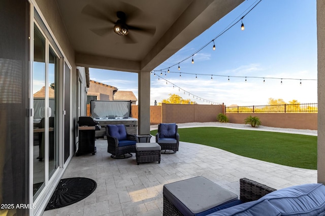 view of patio / terrace featuring grilling area, a fenced backyard, and a ceiling fan