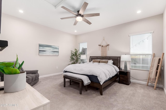 bedroom with recessed lighting, light colored carpet, and baseboards