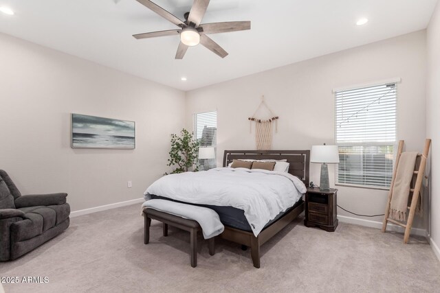 bedroom featuring light colored carpet, baseboards, a ceiling fan, and recessed lighting