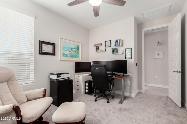 home office with ceiling fan, baseboards, visible vents, and carpet floors