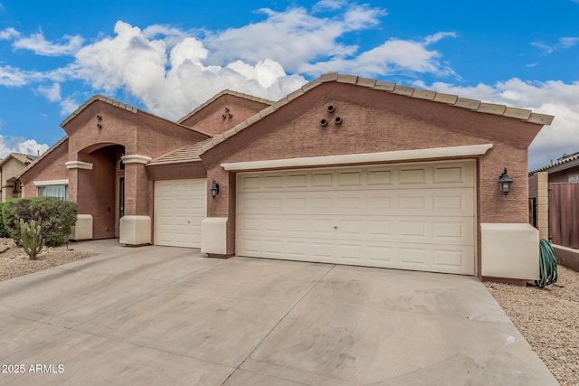 1934 W Morning Vista Ln, Phoenix, AZ 85085 - view of front facade featuring a garage, stucco siding, and concrete driveway