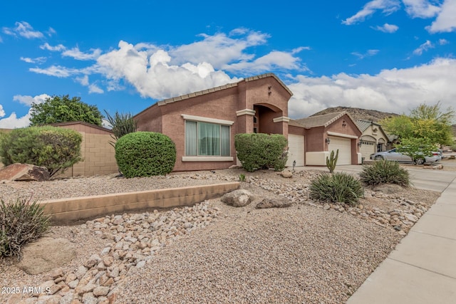 1934 W Morning Vista Ln, Phoenix, AZ 85085 - view of front facade with driveway, a garage, and stucco siding