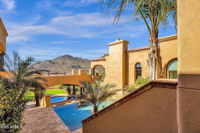 view of swimming pool featuring a mountain view