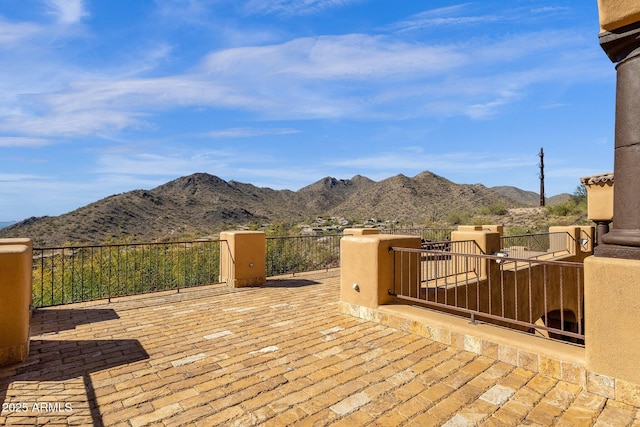 view of patio / terrace featuring a balcony and a mountain view