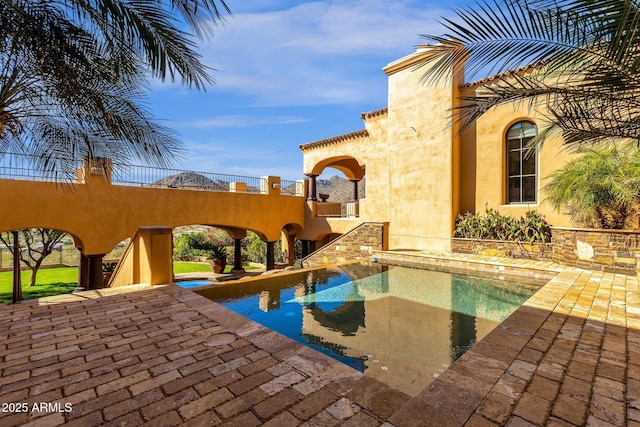 outdoor pool with a patio