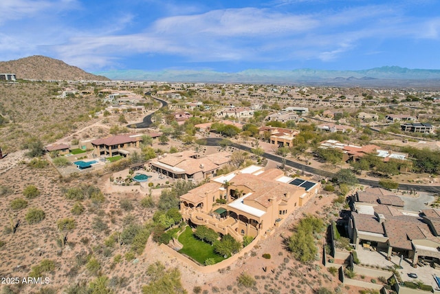 birds eye view of property with a mountain view