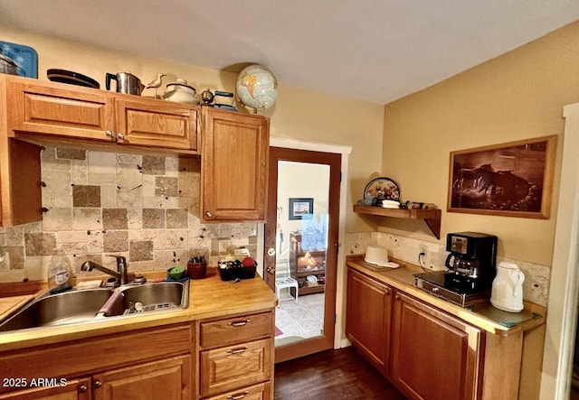 kitchen featuring tasteful backsplash and sink