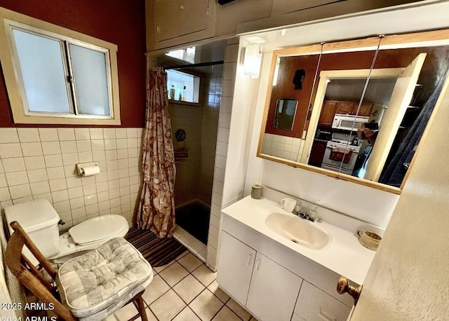 bathroom featuring tile walls, vanity, toilet, tile patterned floors, and a shower with shower curtain