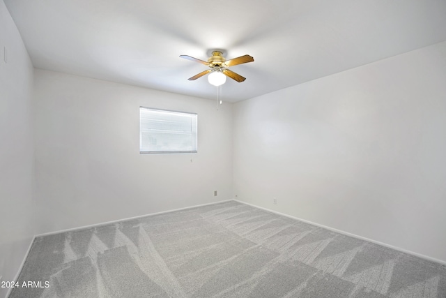 empty room with carpet and ceiling fan