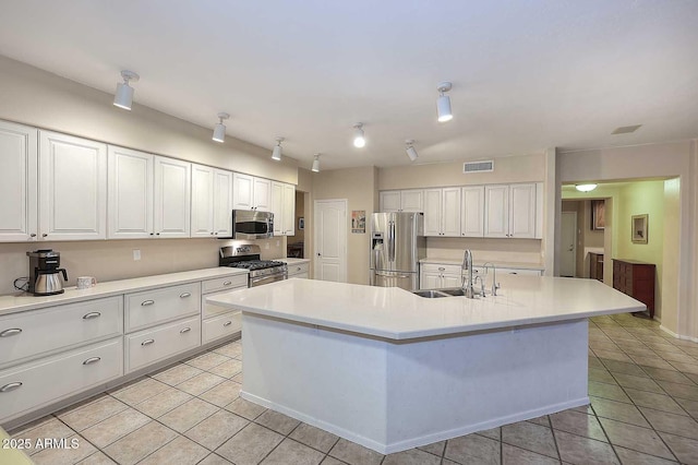 21840 N 43rd St, Phoenix, AZ 85050 - kitchen featuring white cabinets, a sink, appliances with stainless steel finishes, and visible vents