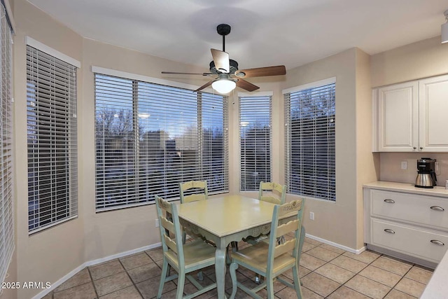 21840 N 43rd St, Phoenix, AZ 85050 - dining space featuring baseboards, ceiling fan, and light tile patterned floors