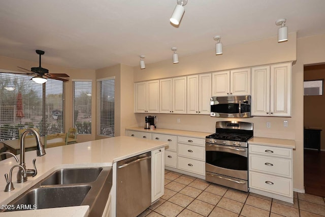 21840 N 43rd St, Phoenix, AZ 85050 - kitchen featuring light countertops, a sink, stainless steel appliances, white cabinets, and ceiling fan
