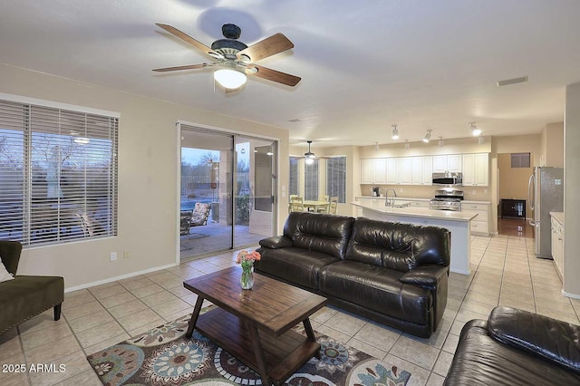21840 N 43rd St, Phoenix, AZ 85050 - living area featuring baseboards, ceiling fan, visible vents, and light tile patterned floors