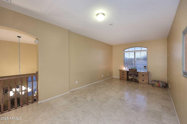 21840 N 43rd St, Phoenix, AZ 85050 - spare room with baseboards, visible vents, and arched walkways