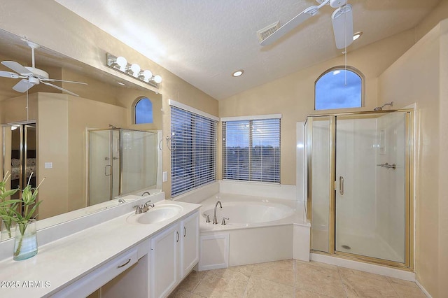21840 N 43rd St, Phoenix, AZ 85050 - bathroom with ceiling fan, a garden tub, tile patterned flooring, and a shower stall