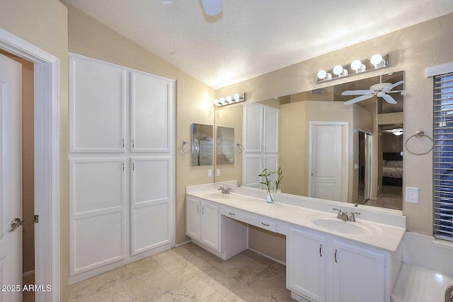 21840 N 43rd St, Phoenix, AZ 85050 - bathroom with double vanity, lofted ceiling, ceiling fan, and a sink