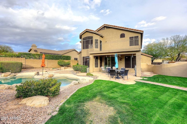 21840 N 43rd St, Phoenix, AZ 85050 - back of house with stucco siding, a sunroom, a fenced backyard, and a patio