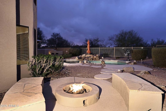21840 N 43rd St, Phoenix, AZ 85050 - view of patio featuring a fenced backyard, an outdoor fire pit, and a fenced in pool