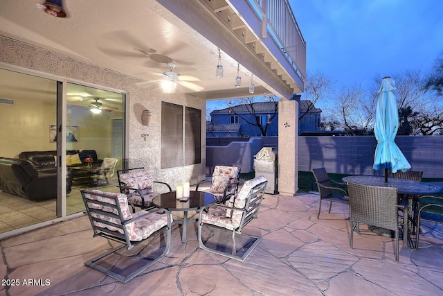 21840 N 43rd St, Phoenix, AZ 85050 - view of patio / terrace featuring fence, a balcony, outdoor dining area, visible vents, and ceiling fan
