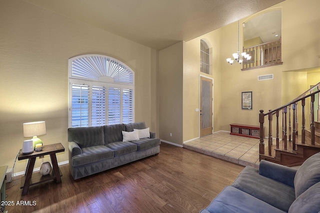 21840 N 43rd St, Phoenix, AZ 85050 - living room with stairs, visible vents, a notable chandelier, and wood finished floors