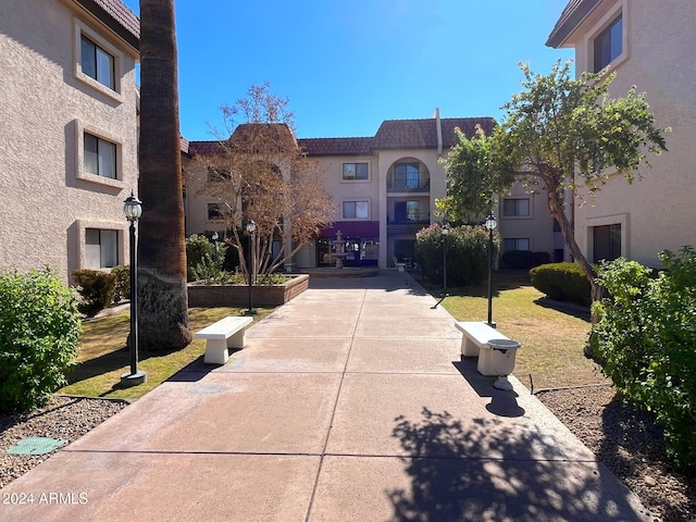 view of property's community with a lawn