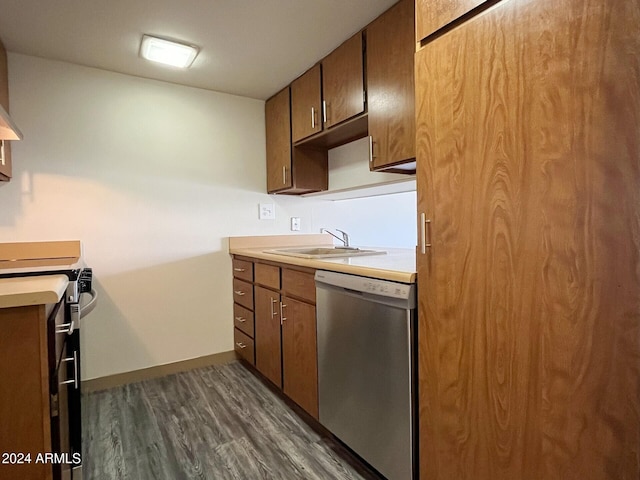 kitchen featuring electric range, sink, stainless steel dishwasher, and dark hardwood / wood-style floors