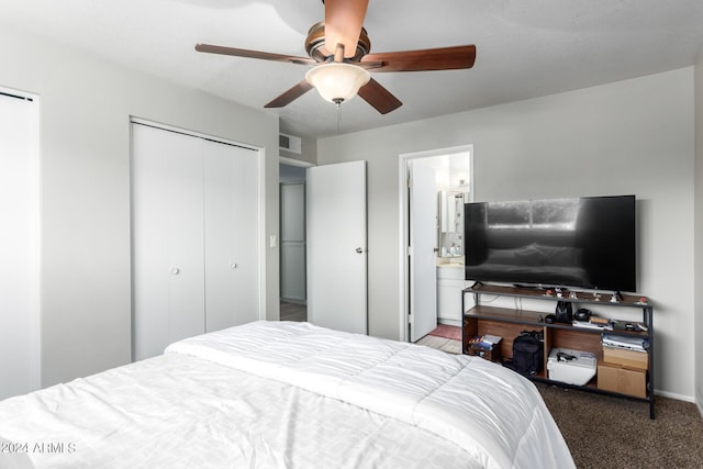 bedroom featuring carpet flooring, ensuite bathroom, a closet, and ceiling fan