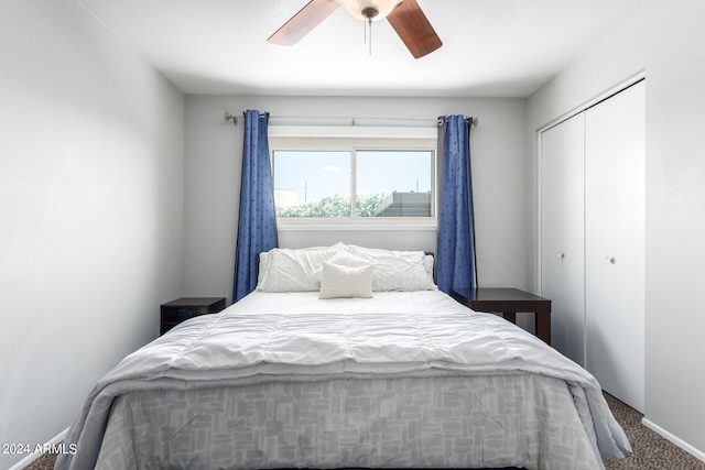 carpeted bedroom with a closet and ceiling fan