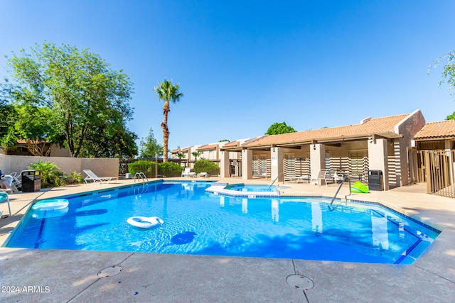 view of pool featuring a patio area