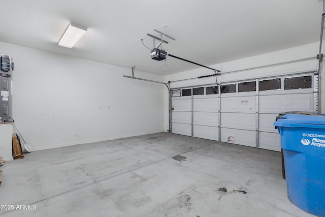 garage featuring baseboards and a garage door opener