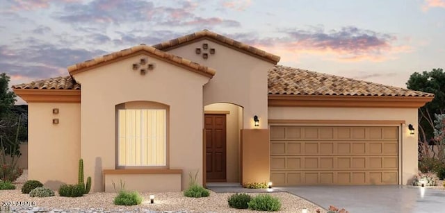 16343 W Morning Glory St, Goodyear, AZ 85338 - mediterranean / spanish house featuring an attached garage, a tile roof, driveway, and stucco siding