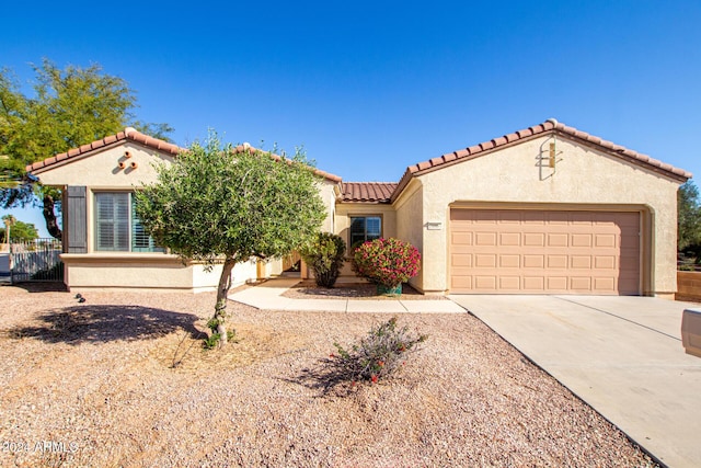 mediterranean / spanish-style home featuring a garage