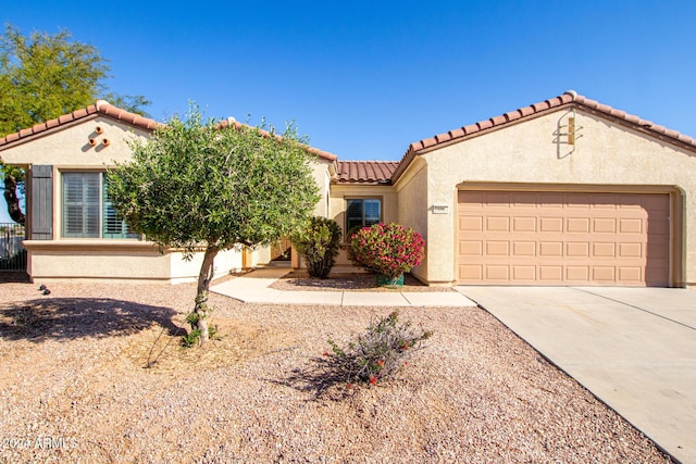 mediterranean / spanish-style house featuring a garage