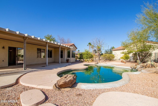 view of swimming pool featuring a patio