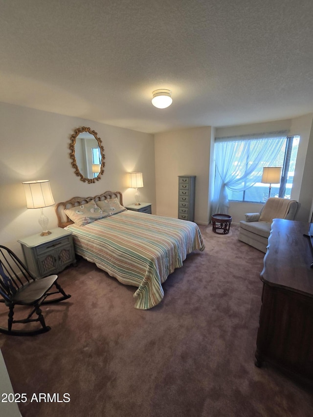 carpeted bedroom with a textured ceiling