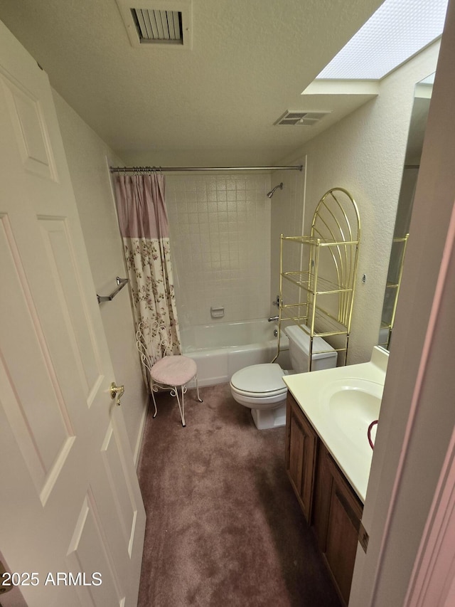 bathroom featuring vanity, shower / tub combo, toilet, and visible vents