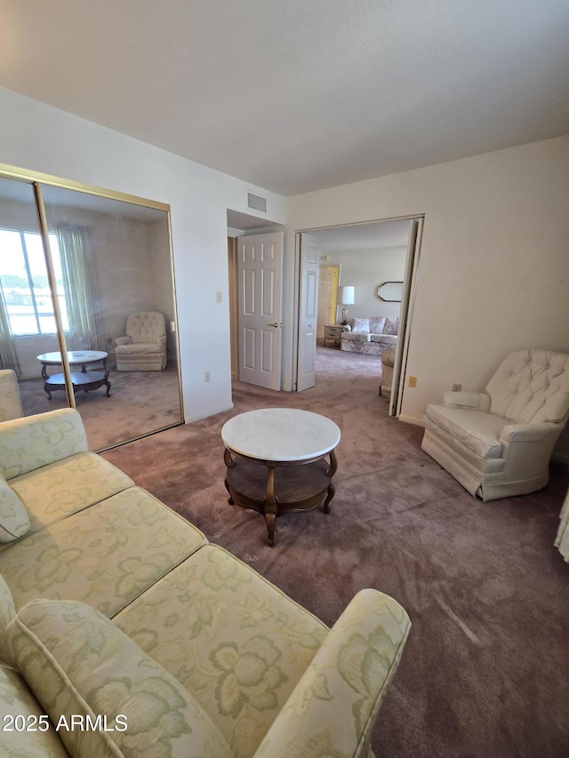 carpeted living room with visible vents