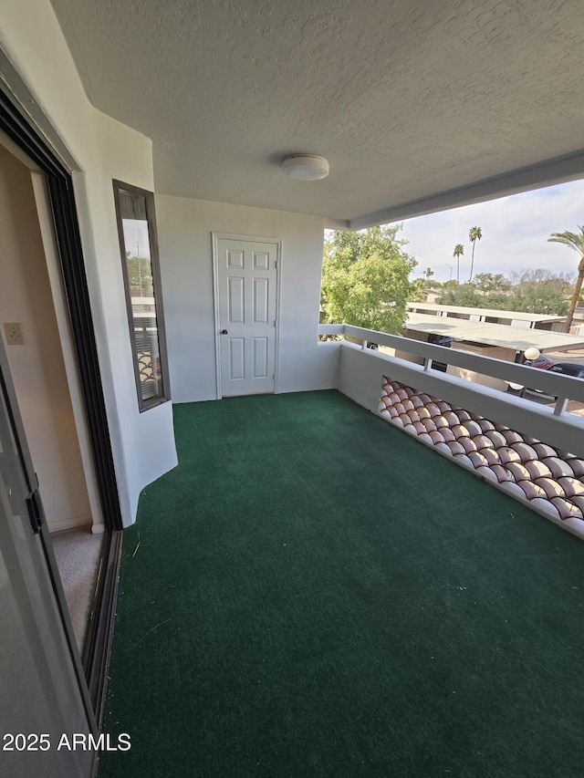 view of patio with a balcony