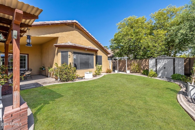 view of yard featuring a patio and a storage shed