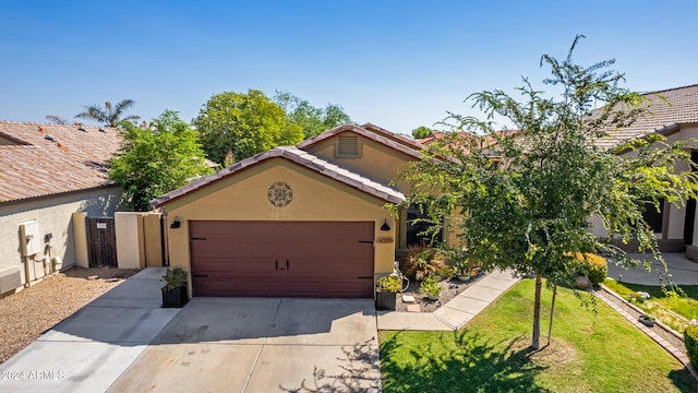 view of front of house with a garage and a front yard