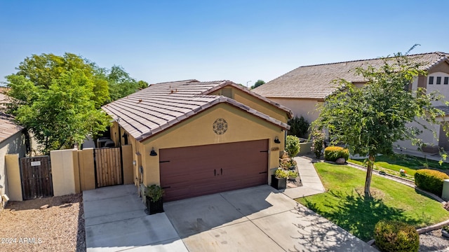 view of front of property with a garage and a front yard