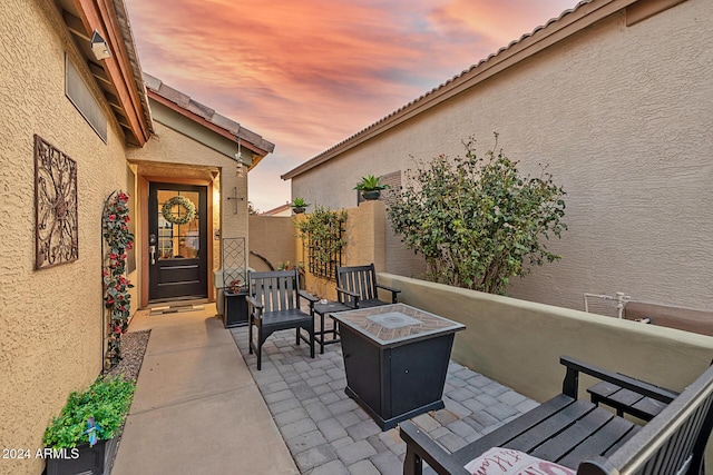 patio terrace at dusk with a fire pit